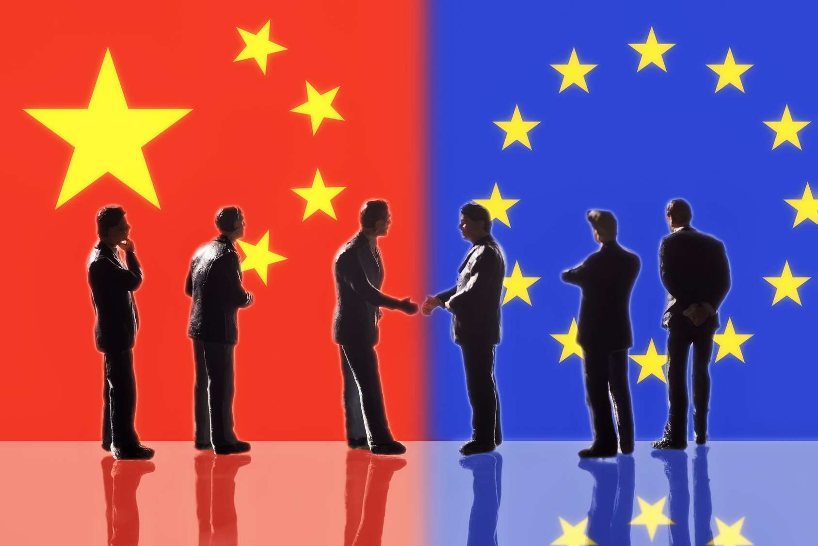 Chineese and european flags, businessmen shake hands on both sides